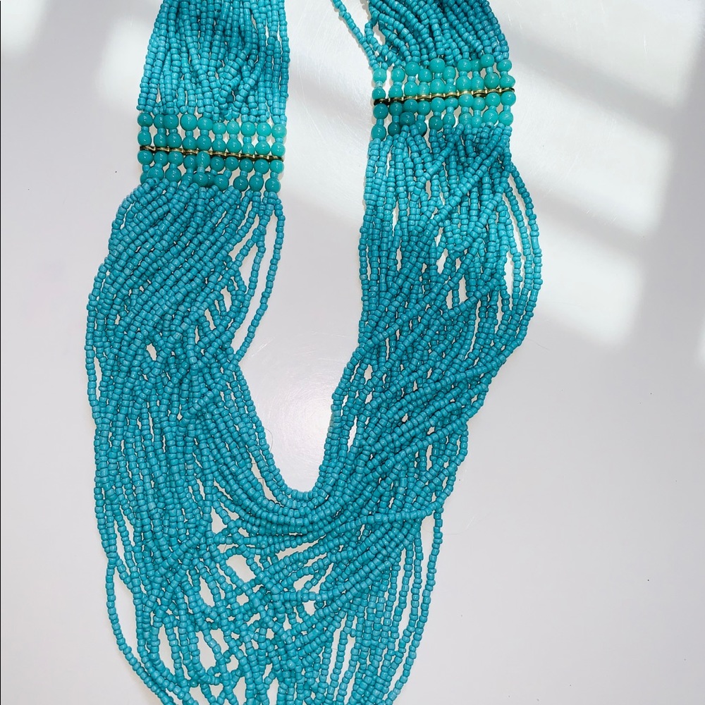 Aqua beaded layered necklace with a gold accent